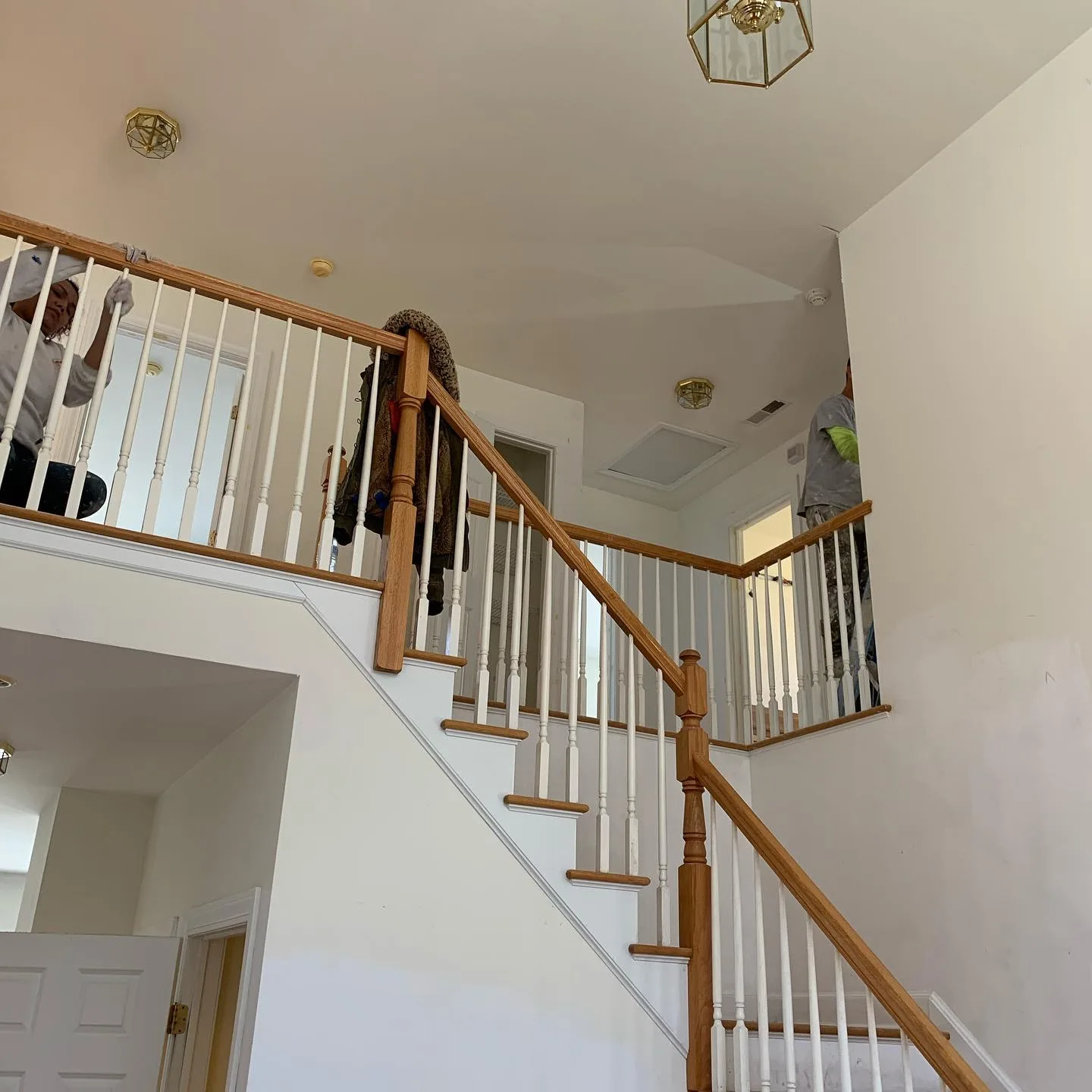 Interior home renovation: Staircase area with painting preparation